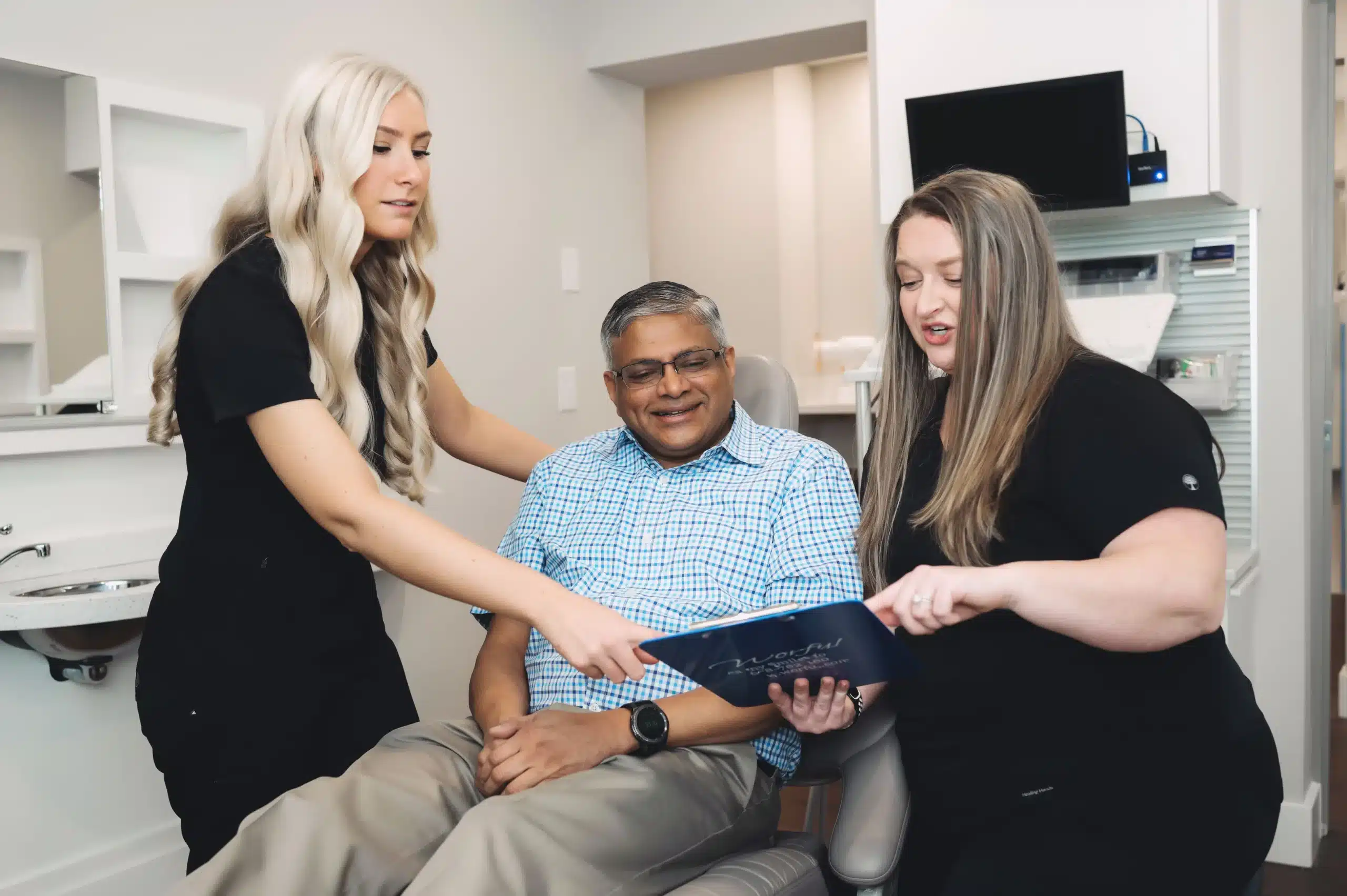 Team members reviewing a treatment plan with a patient