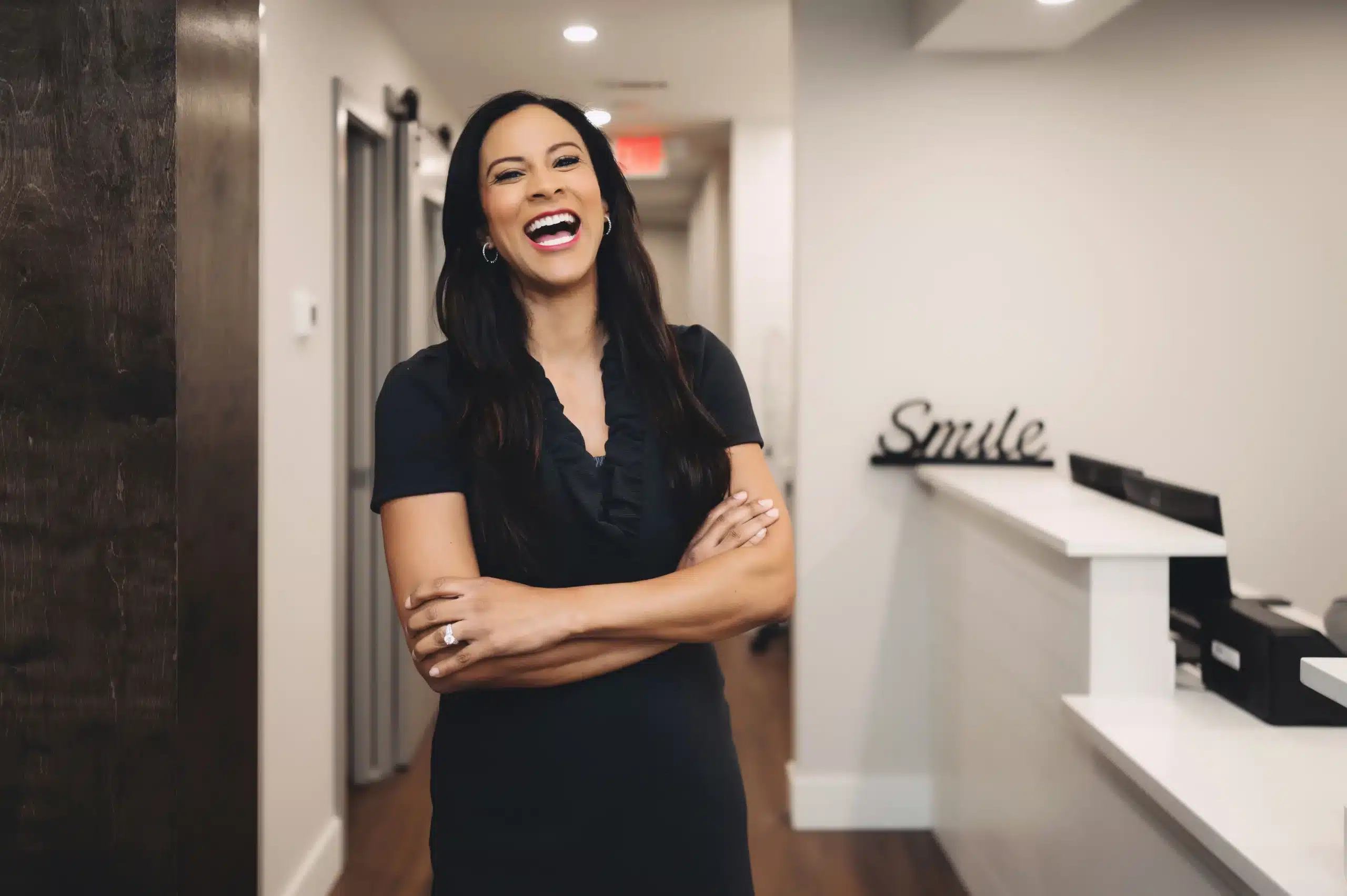 Smiling team member at the Alpharetta Smile Care front desk