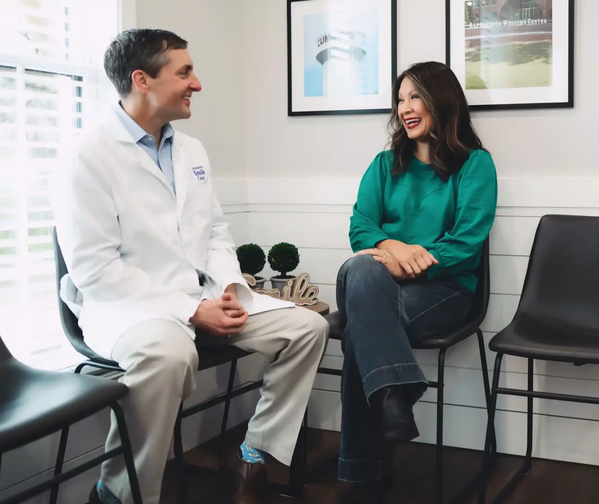 Dr. Worful talking with a patient in the office