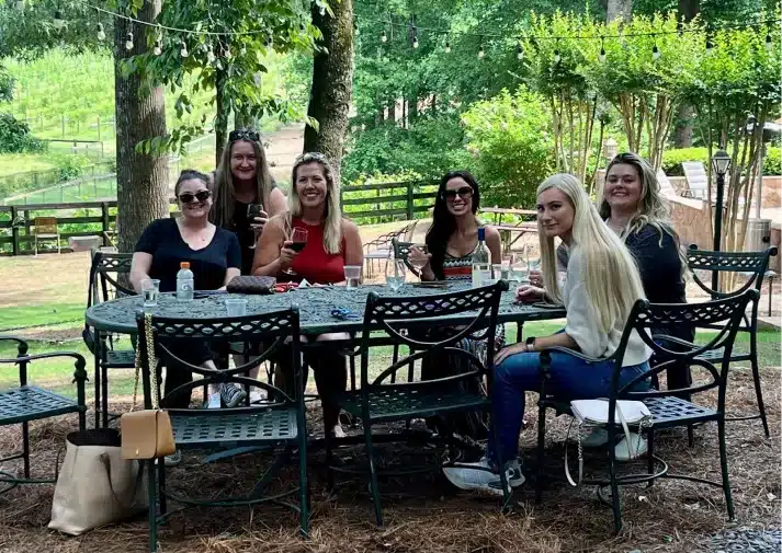 Alpharetta Smile Care team gathered at an outdoor table