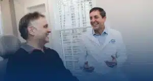 Dr. Worful chatting with a patient in the treatment room
