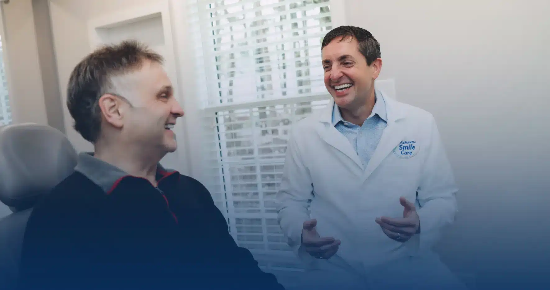 Dr. Worful chatting with a patient in the treatment room