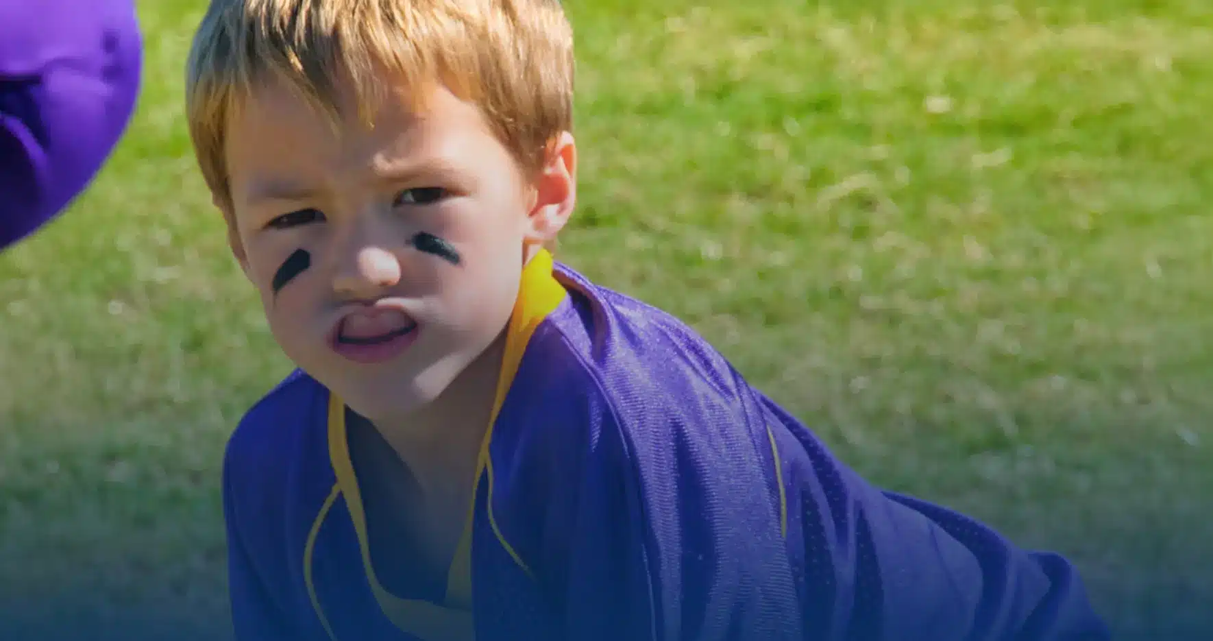 Boy playing youth football