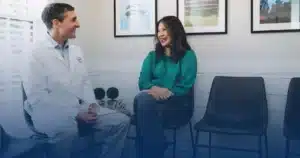 Dr. Worful talking with a patient in the office
