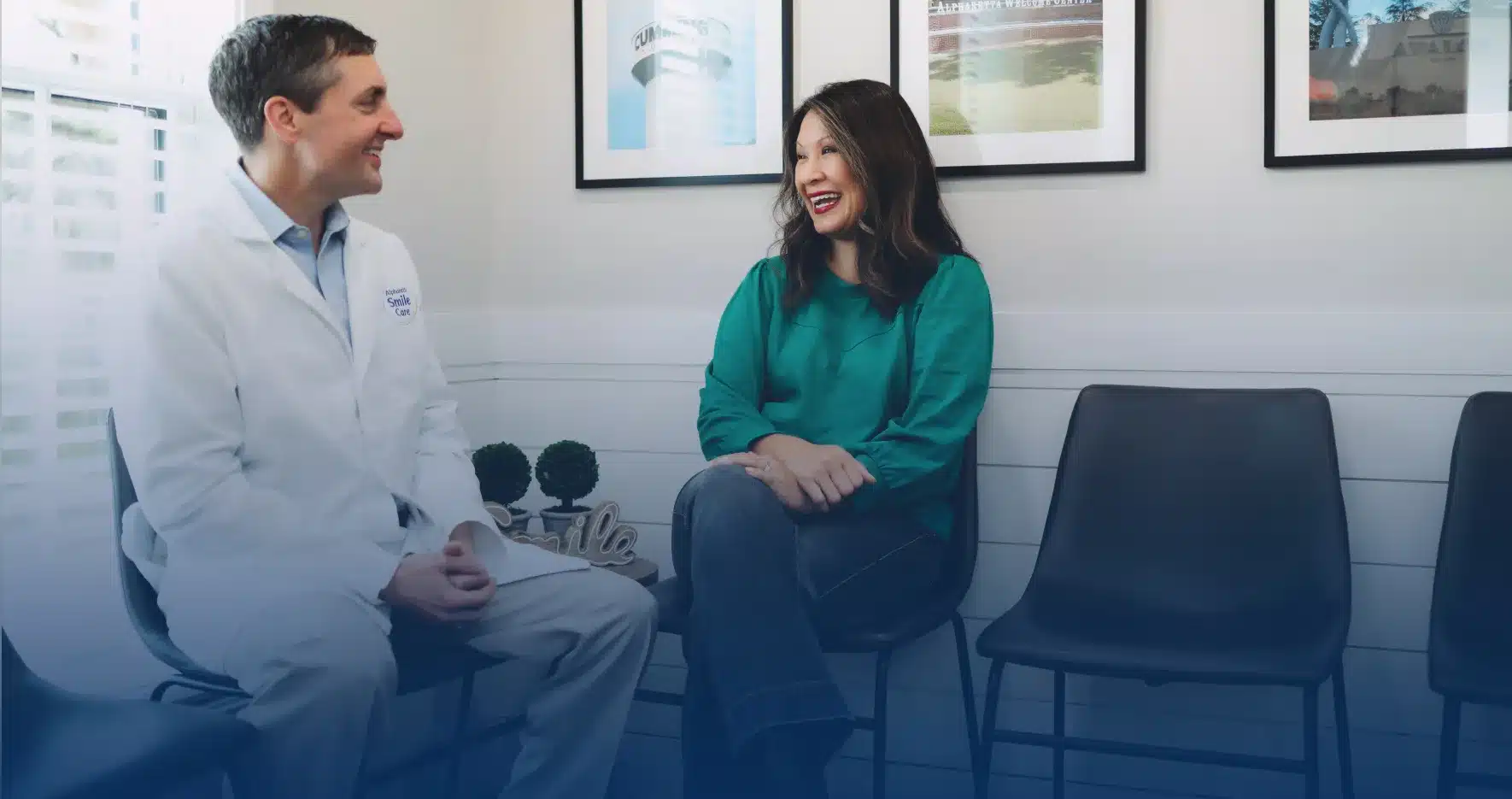 Dr. Worful talking with a patient in the office
