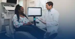 Dr. Worful consulting with a patient in the treatment chair