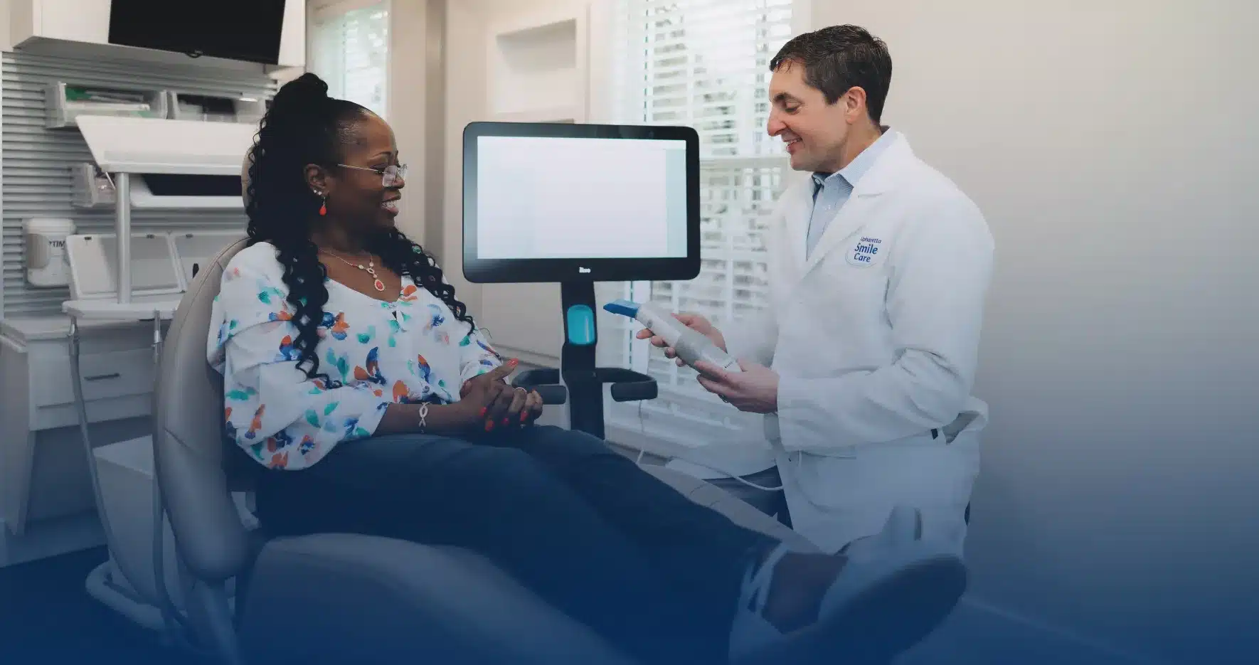 Dr. Worful consulting with a patient in the treatment chair