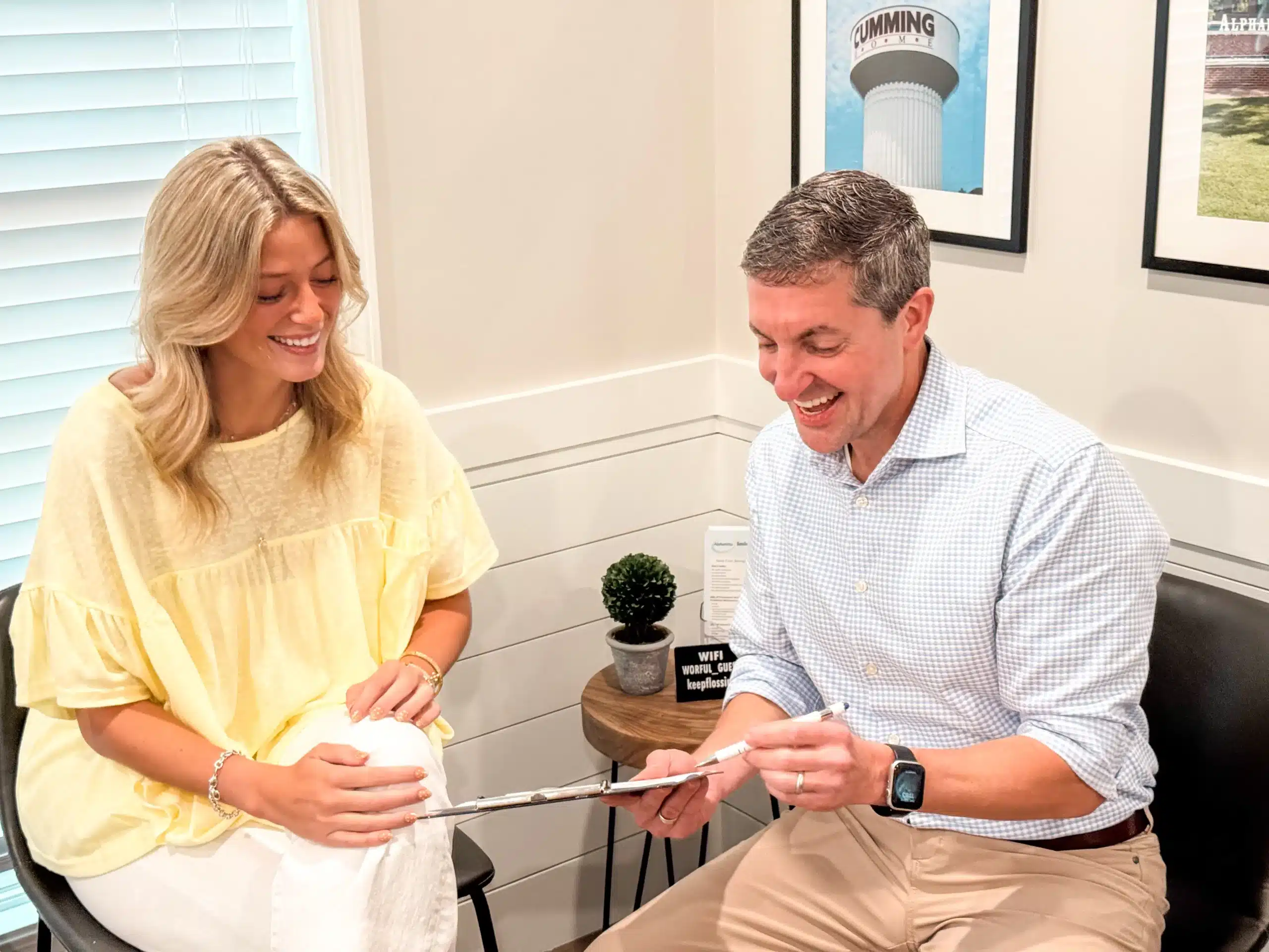 Dr. Worful discussing Invisalign costs with a patient