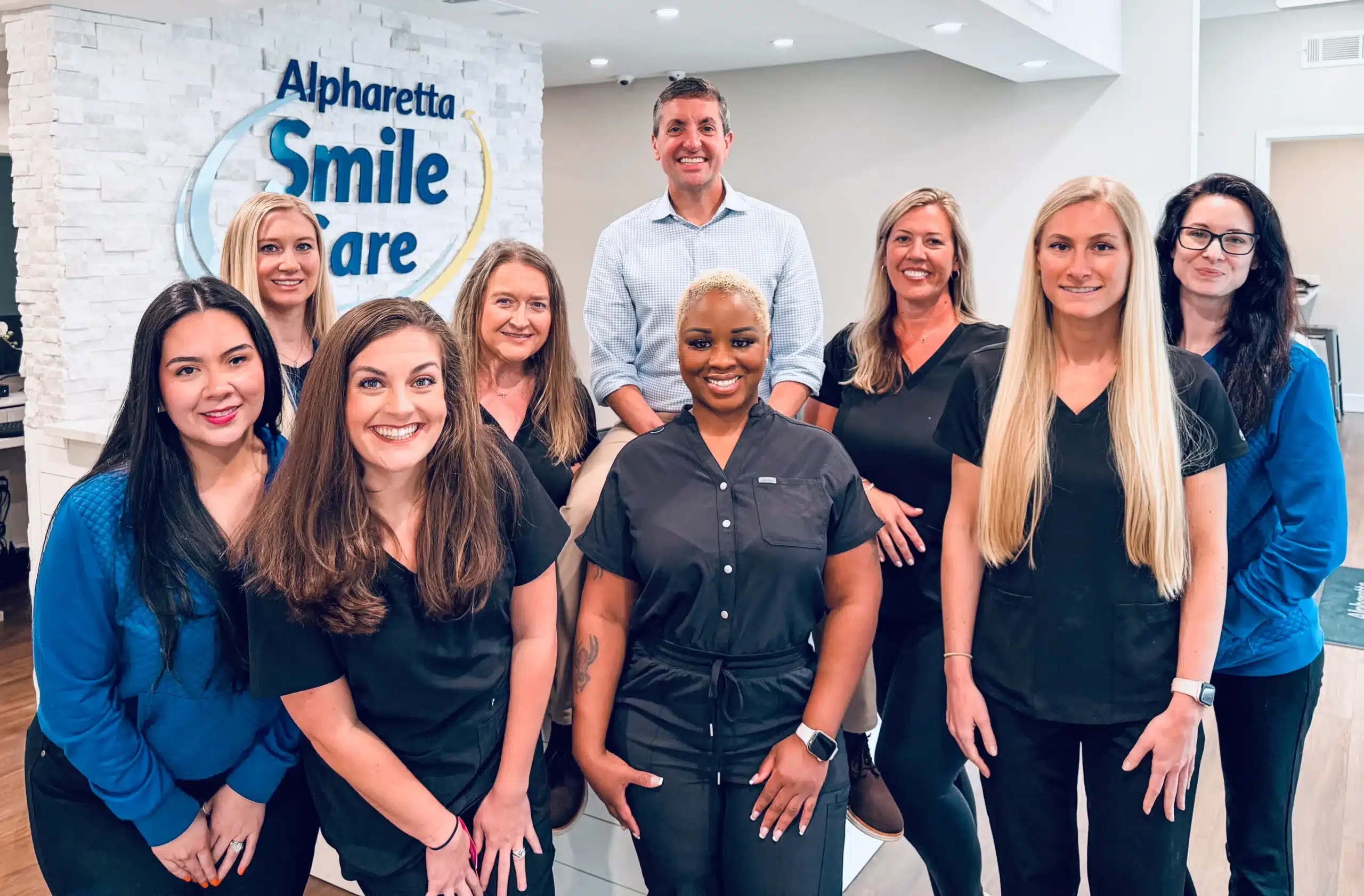 The Alpharetta Smile Care team in the office lobby