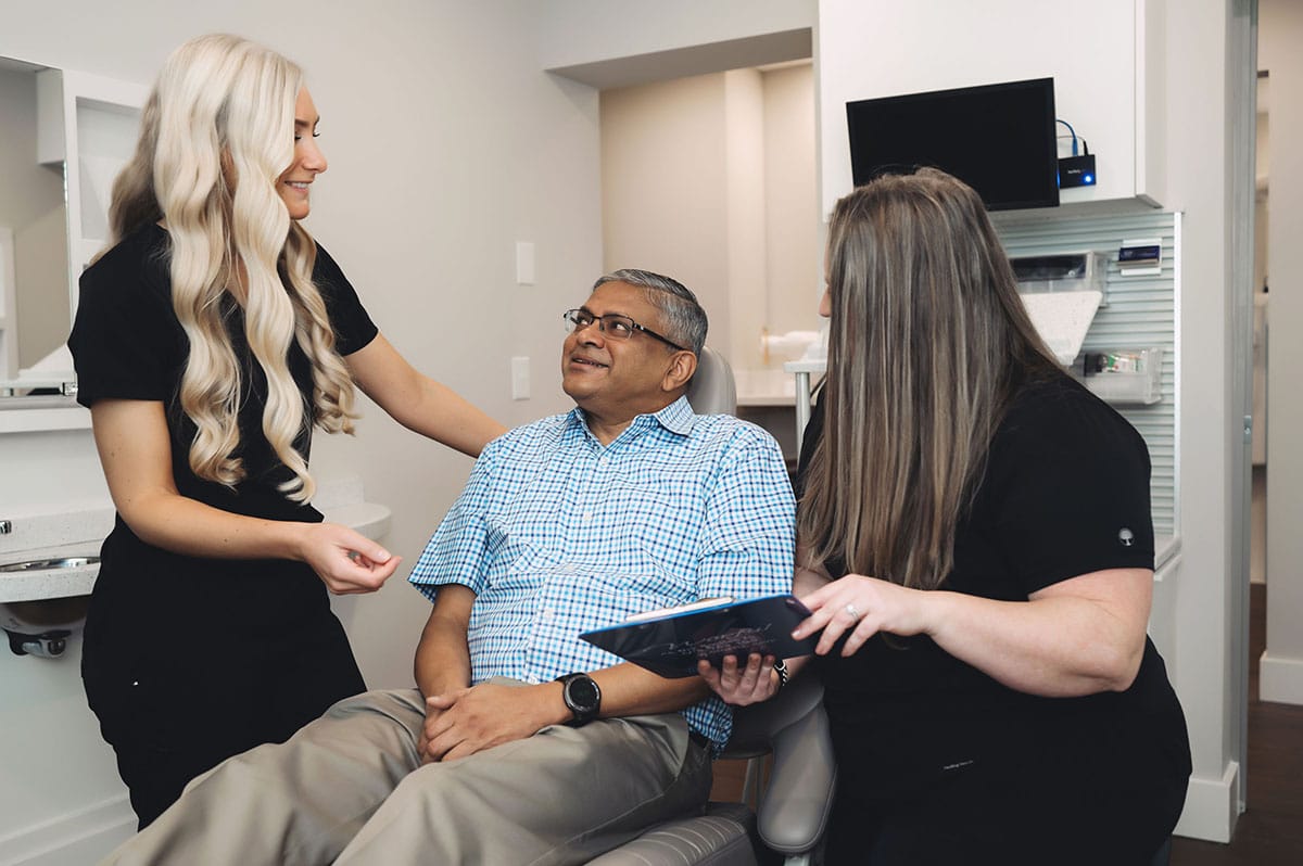 Team members reviewing a treatment plan with a patient