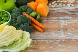 Healthy vegetables including broccoli, carrots, peas and cabbage