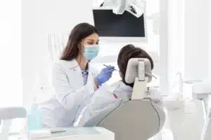 Dentist treating a patient in the dental chair