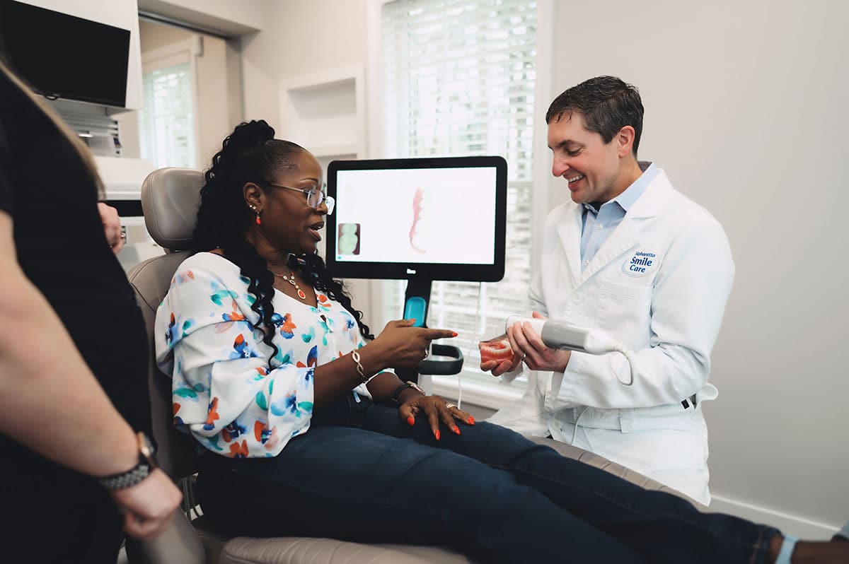 Dr. Worful showing a patient her scan on screen