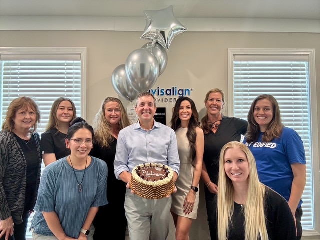 The Alpharetta Smile Care team celebrating Invisalign provider status